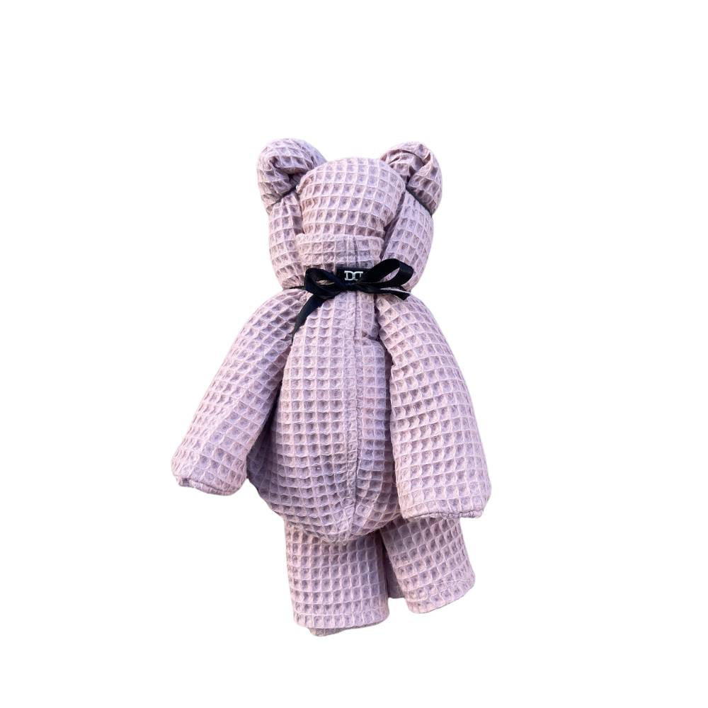 Badeponcho für Kinder als süßen Teddybär gebunden. Perfektes Geschenk zur Geburt oder Geburtstag.