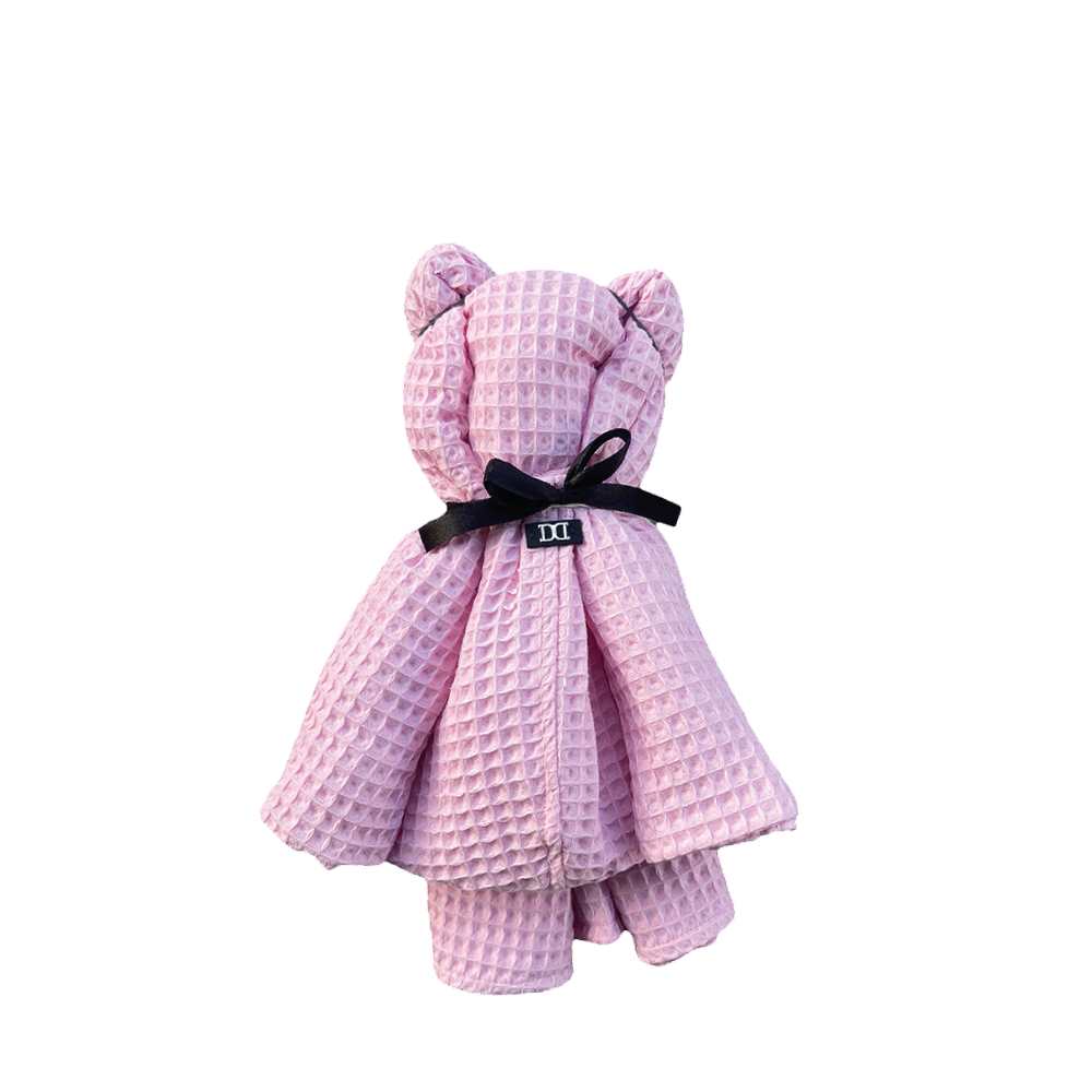 Badeponcho in rosa als Teddybär gebunden ist das perfekte Geschenk für Kinder